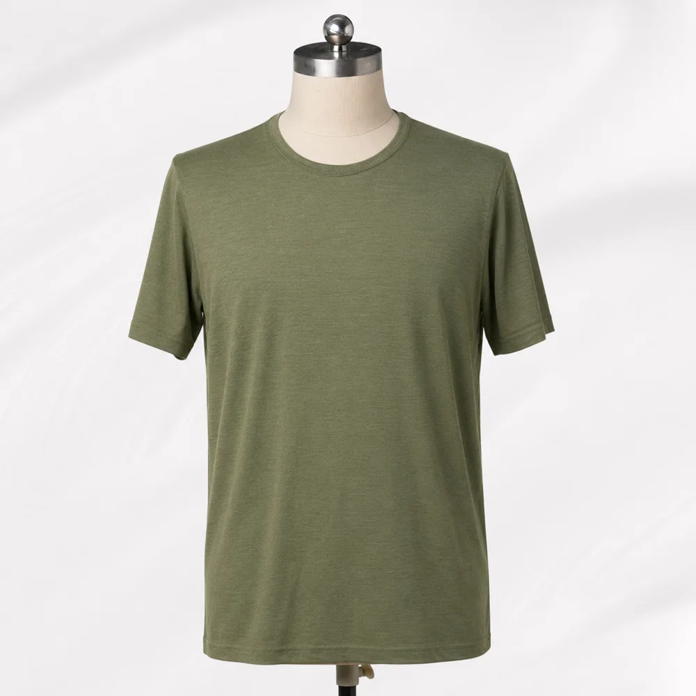 Olive green merino wool T-shirt sample displayed on a mannequin.